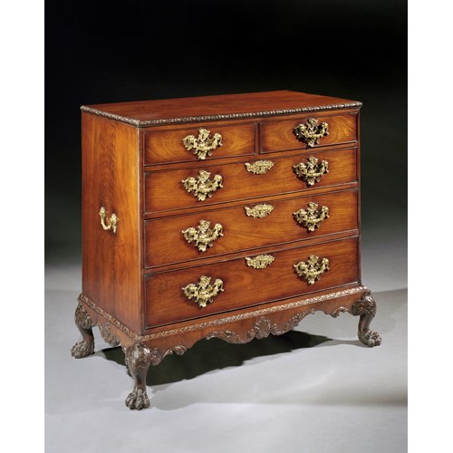 A George II rosewood chest of drawers on stand attributed to Otho Channon
